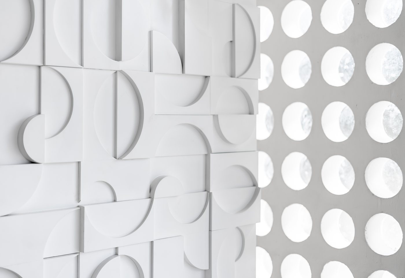 White relief wall panels in geometric patterns
