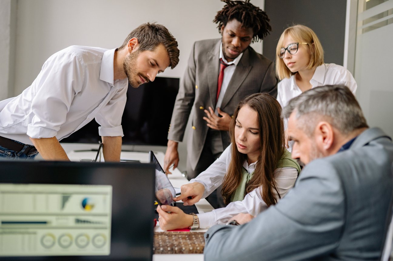 A team reviewing a screen together at a desk